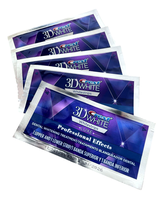 Multiple packages of Crest 3D White whitestrips on a white background